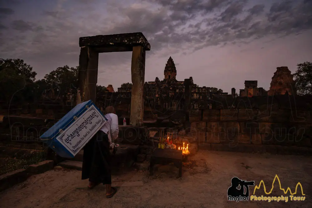Bayon temple stone faces bathed in golden light