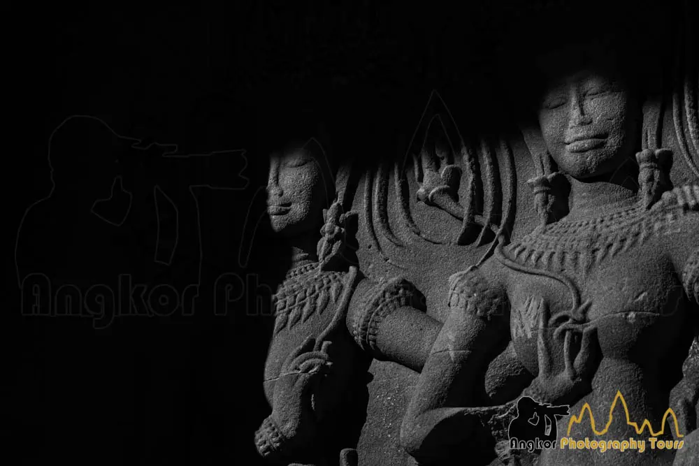 Bayon temple towers silhouetted against a vivid sunset